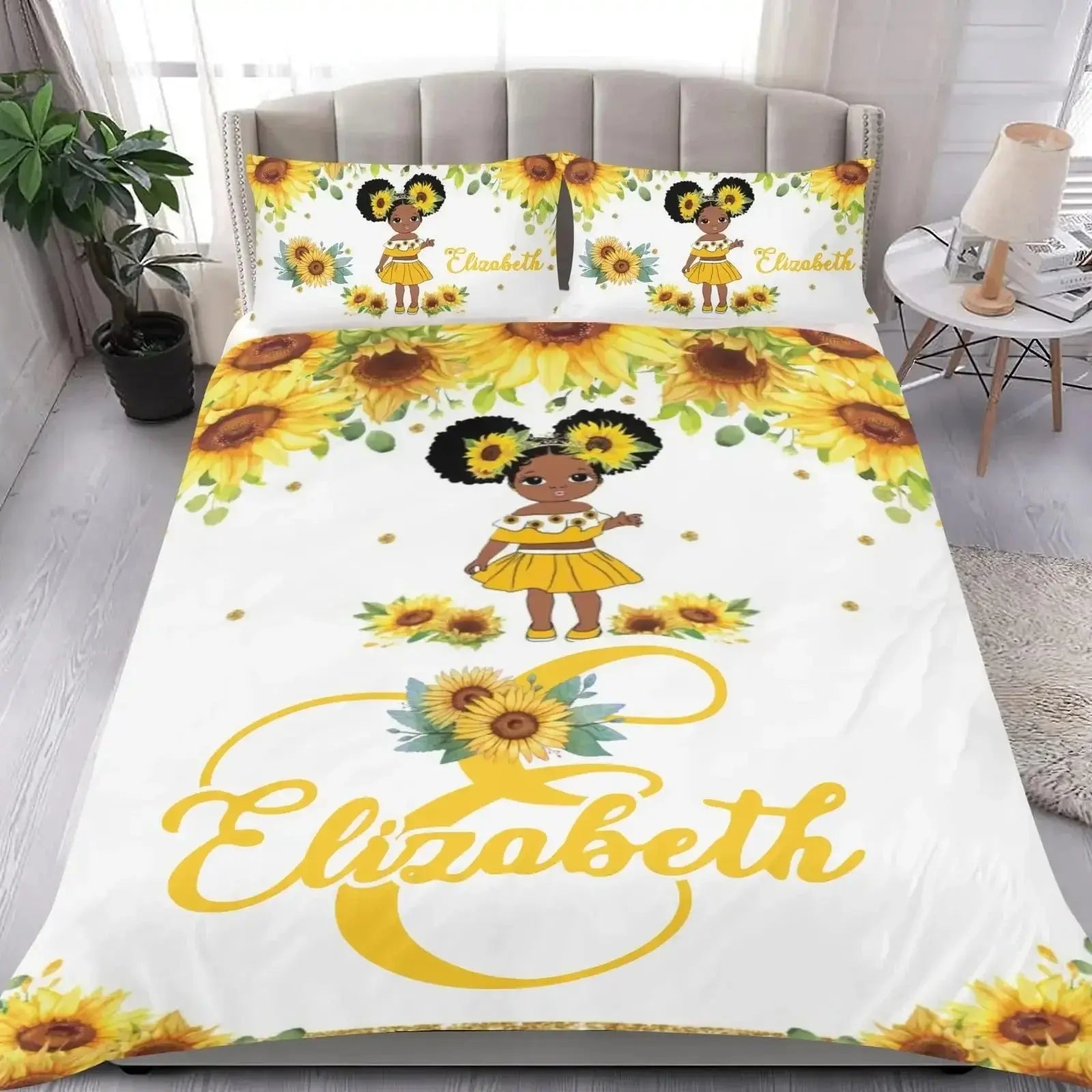 Bedding set with sunflower design and personalized text displayed in a cozy bedroom setting