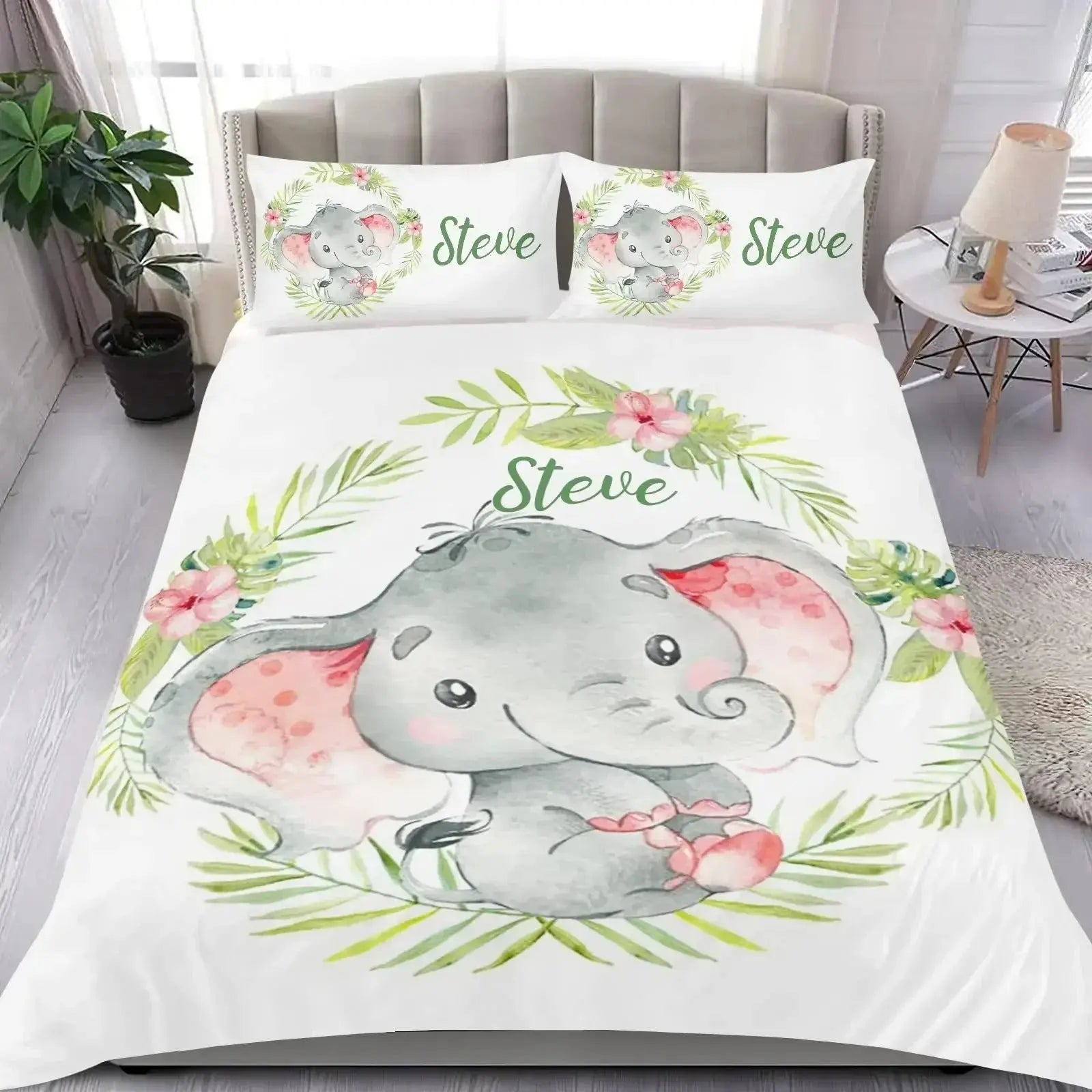Bedding set featuring elephant design and text on a bed in a cozy bedroom setting