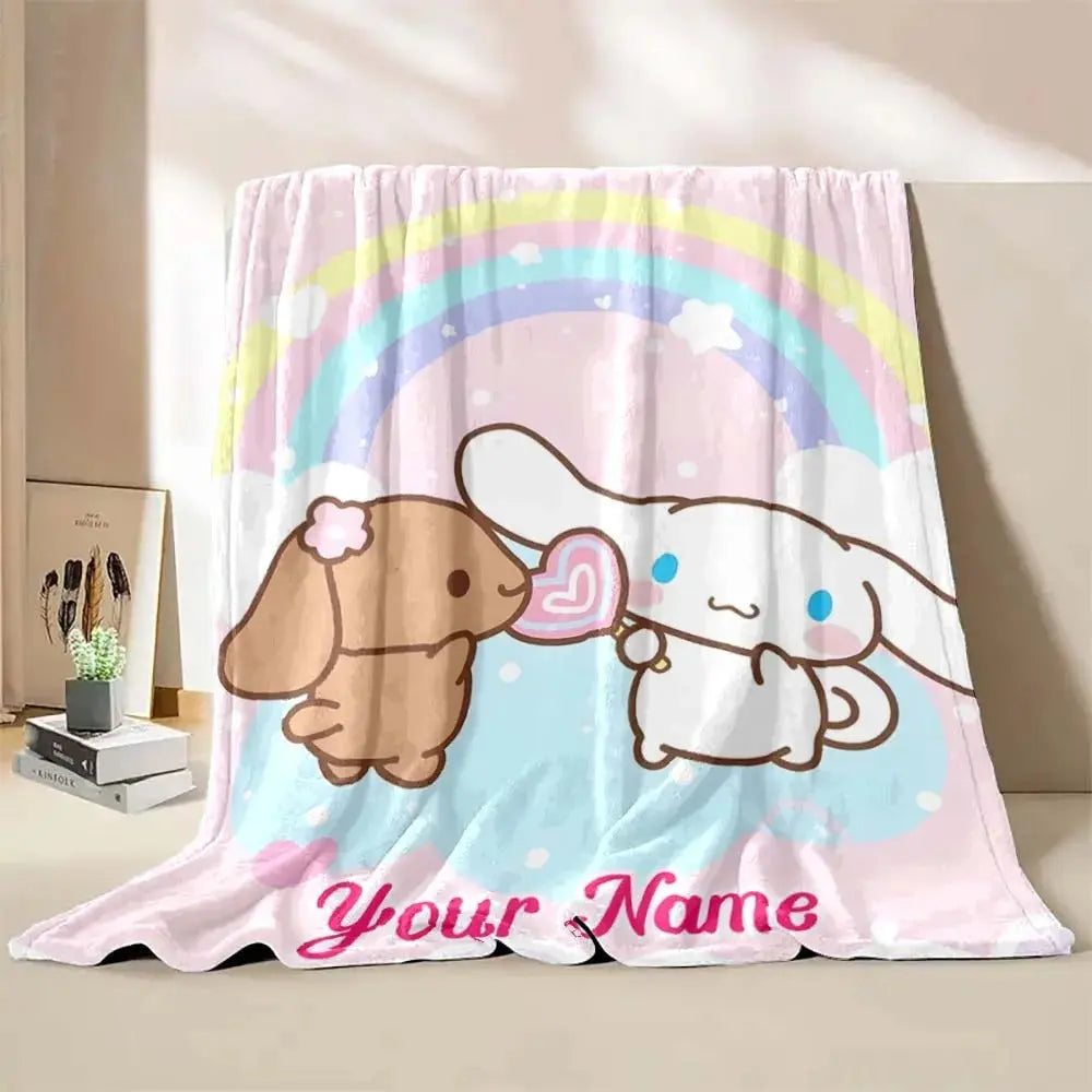 Custom name Cinnamoroll kids blanket placed on a bed, perfect for soft and cozy bedroom comfort