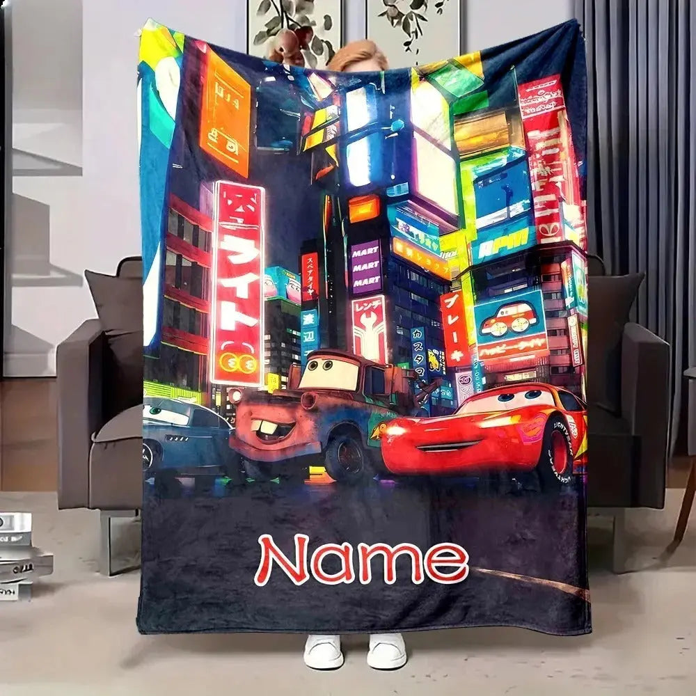 Cozy Disney Cars-themed blanket with Lightning McQueen and name customization, draped over a bed