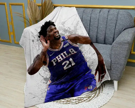 Joel Embiid splash effect flannel blanket featuring bold NBA player graphics, ultra-soft warm fabric, and vibrant basketball design perfect for fans’ bedding or sofa throw