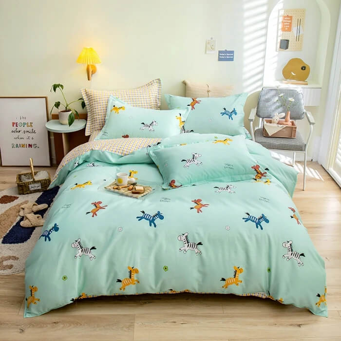 Children's bedroom with a bed featuring cartoon animal patterns