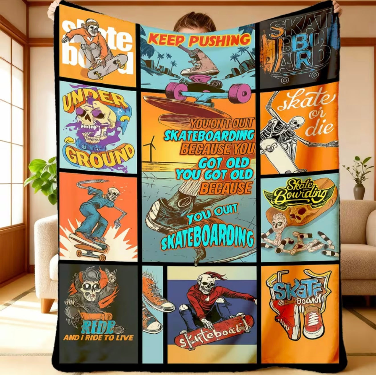 Multicolored blanket with various skateboarding-themed designs displayed on a couch.