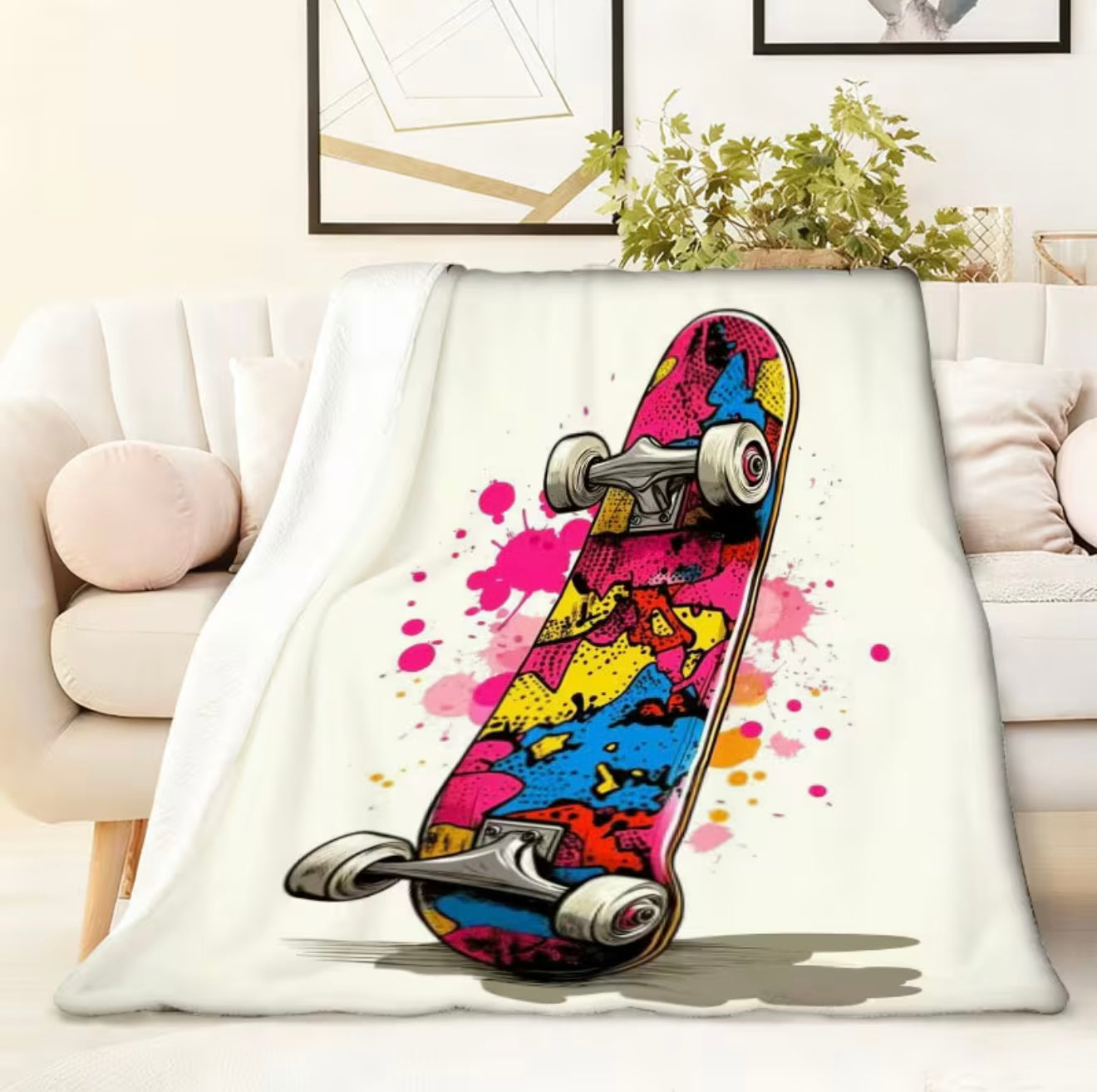 Colorful skateboard design on a white blanket in a living room setting