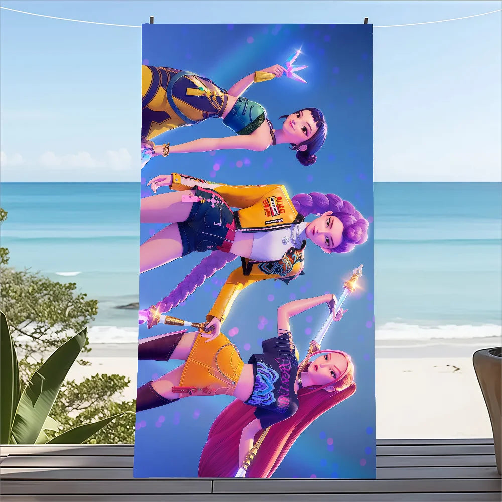 K-pop Demon Hunter beach towel for kids with colorful character design on sand