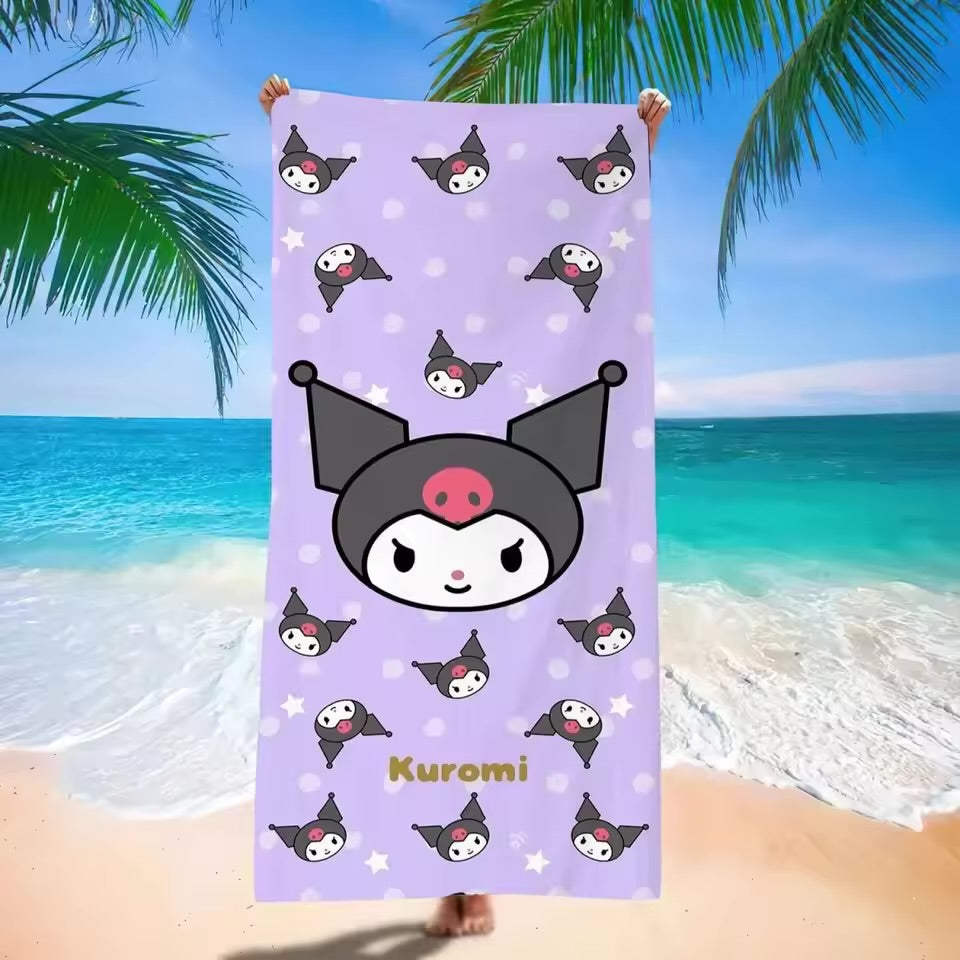 Kuromi-themed beach towel held up against a tropical beach background