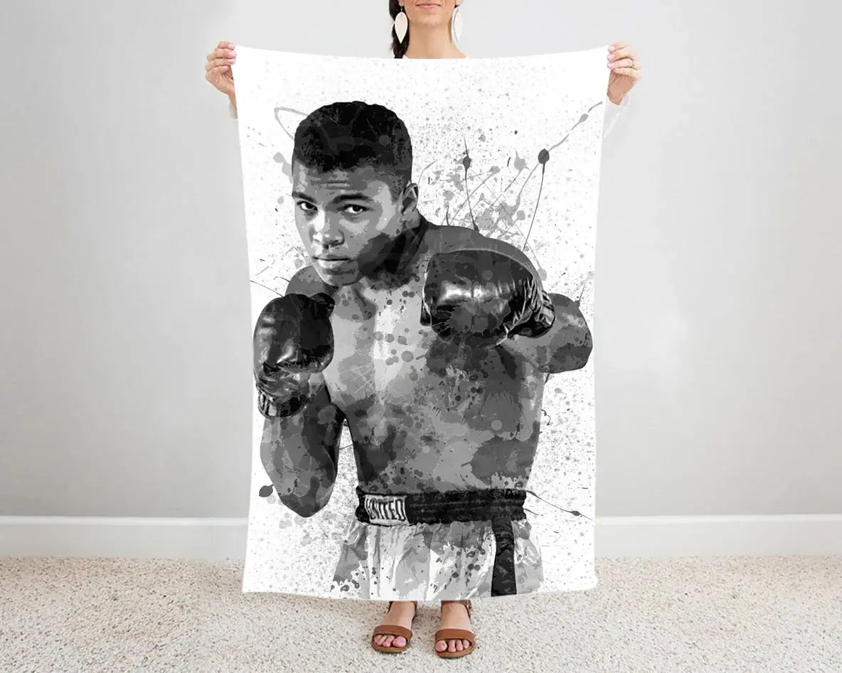 Muhammad Ali splash effect flannel blanket black and white design featuring iconic boxing legend artwork, ultra-soft warm fabric, perfect for fans’ bedding or sofa throw