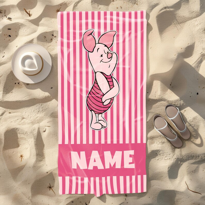 Personalized Piglet beach towel with pink and white stripes, featuring Piglet from Winnie the Pooh and a customizable name section at the bottom.