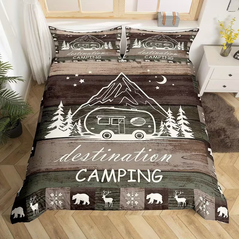 A camping-themed bedding set featuring a duvet cover and two pillowcases with a rustic wood-plank design, white line art of a camper van, mountains, trees, stars, and the words 'destination CAMPING'. The set is displayed on a bed in a styled bedroom setting.