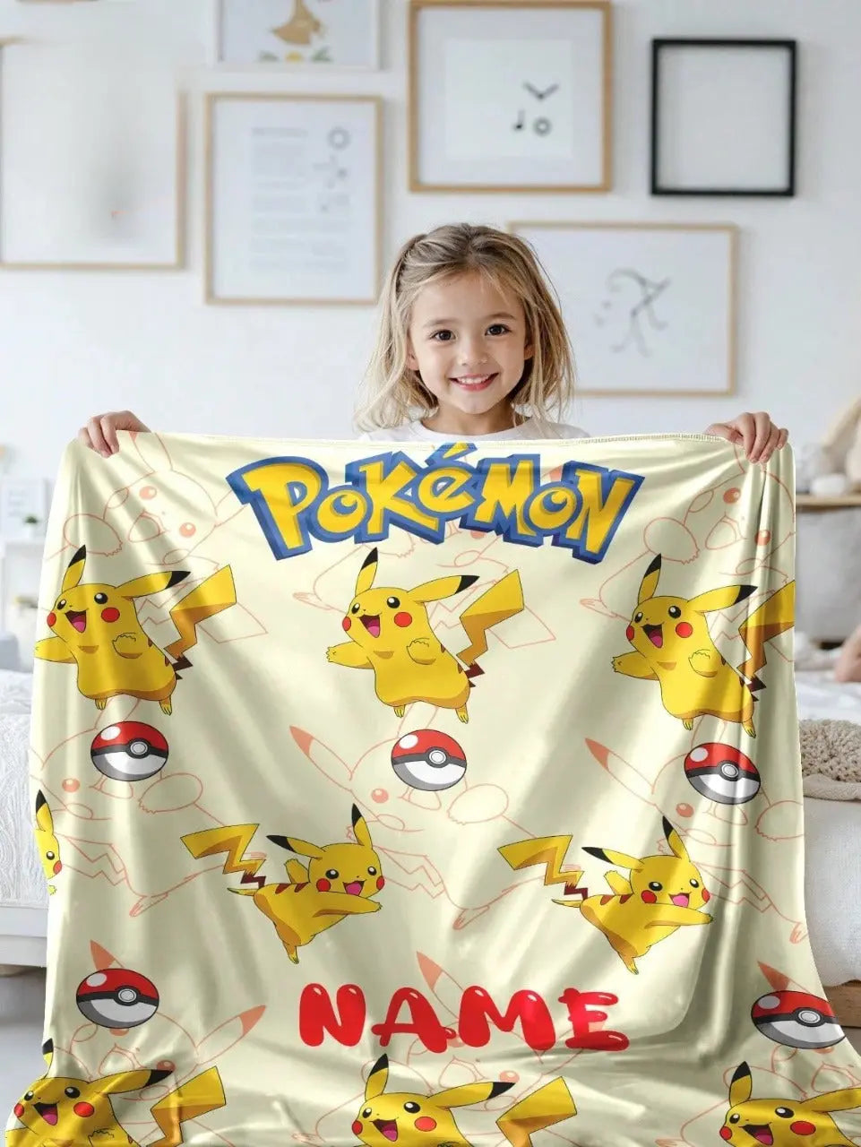 Child holding custom Pokémon blanket with Pikachu and Poké Balls, personalized kids blanket for bedroom decor