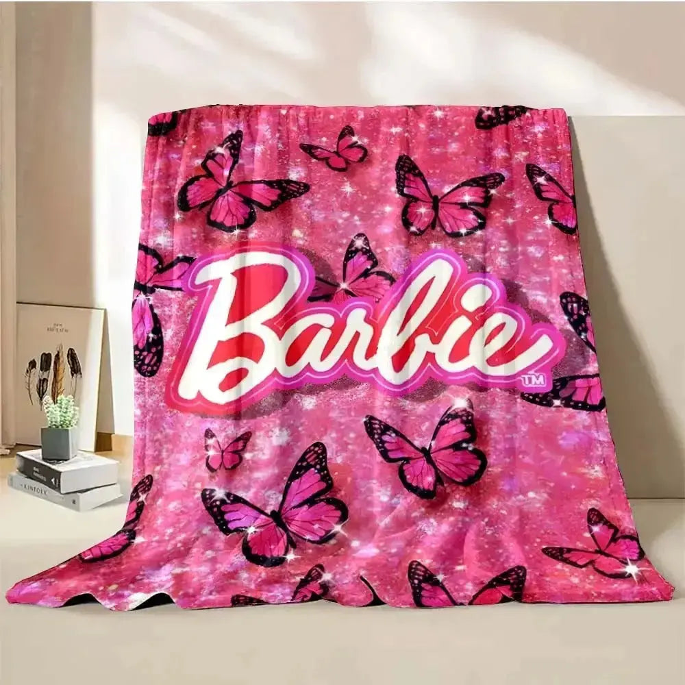 Barbie pink throw blanket draped stylishly over a sofa