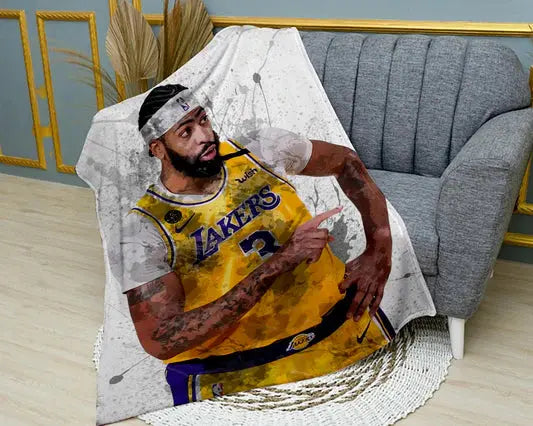 Anthony Davis Los Angeles Lakers flannel blanket featuring bold NBA basketball player graphics, ultra-soft warm fabric, and vibrant Lakers-themed design perfect for fans’ bedding or couch throw