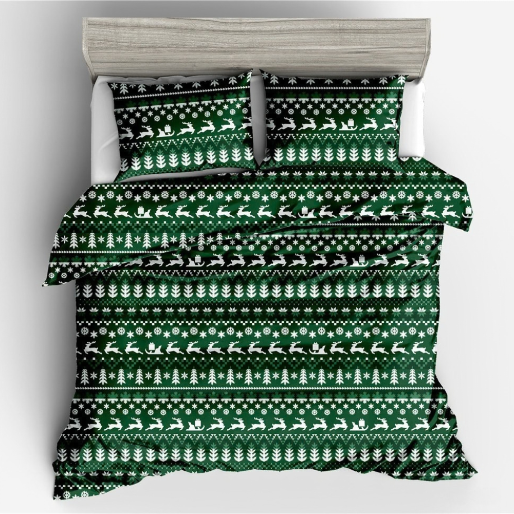 A bedding set featuring a green and white Christmas-themed pattern with reindeer, trees, and snowflakes