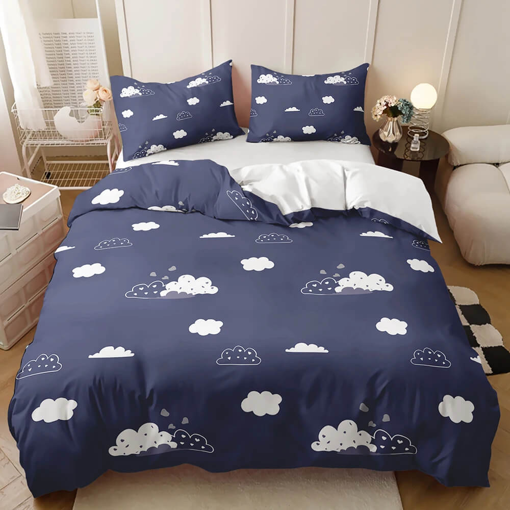 A navy blue bedding set with a white cloud pattern modern bedroom setting.