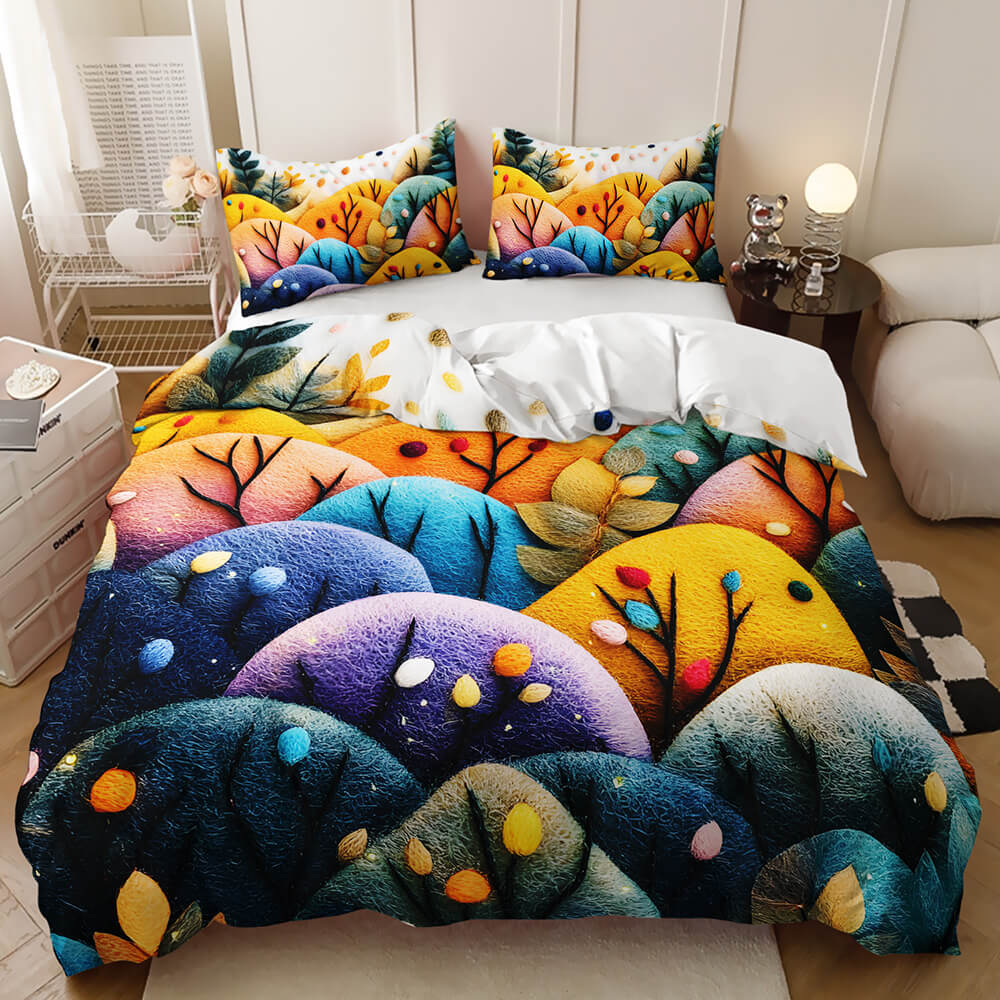 A colorful forest-themed bedding set featuring a duvet cover and two matching pillowcases with a vibrant, textured 3D-style print of trees and foliage in shades of blue, green, yellow, orange, and purple, styled on a bed in a modern bedroom setting.