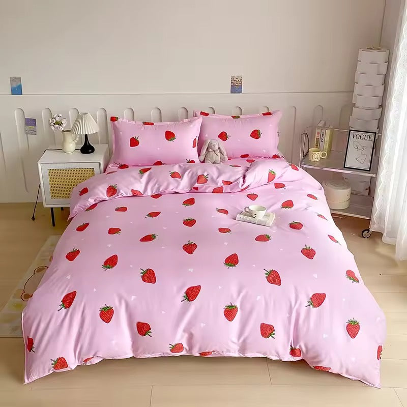 "Colorful strawberry and tropical fruit-themed duvet cover set for girls, displayed on a neatly made bed in a bright, cheerful kids' bedroom with matching pillowcases."