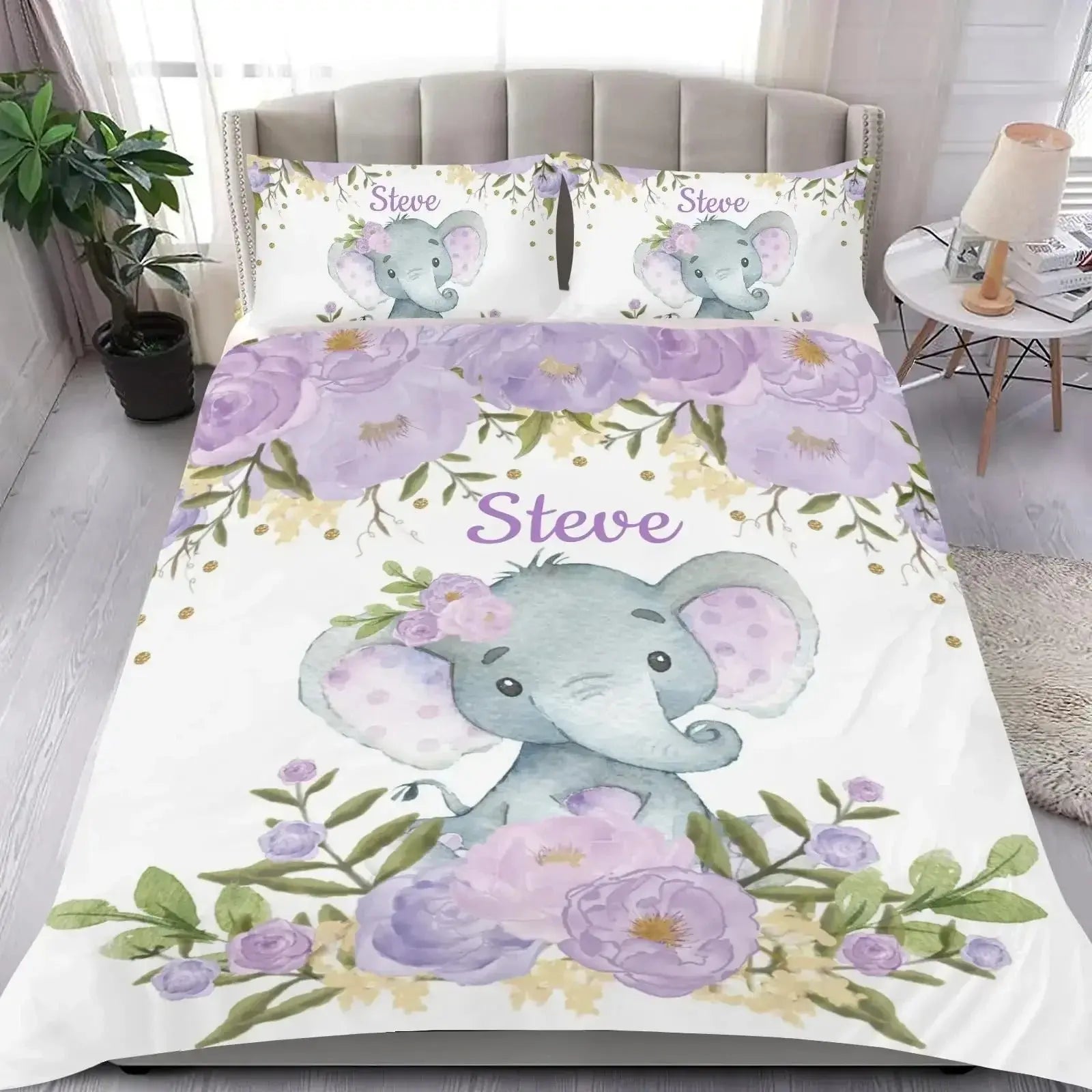 Children’s duvet cover set featuring elephant design and ‘name’ branding displayed on a bed in a cozy bedroom setting