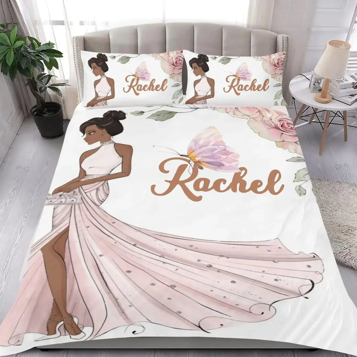 Elegant bedding set featuring a woman in a gown with floral elements and ‘Name’ design, displayed on a bed in a stylish bedroom setting.