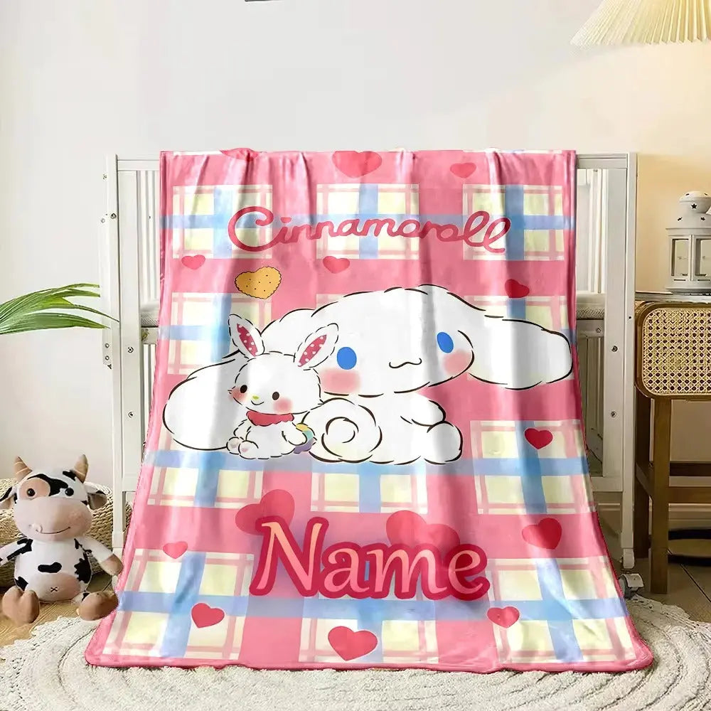 Soft fluffy Sanrio blanket with custom name design and Cinnamoroll character, styled on a child’s bed