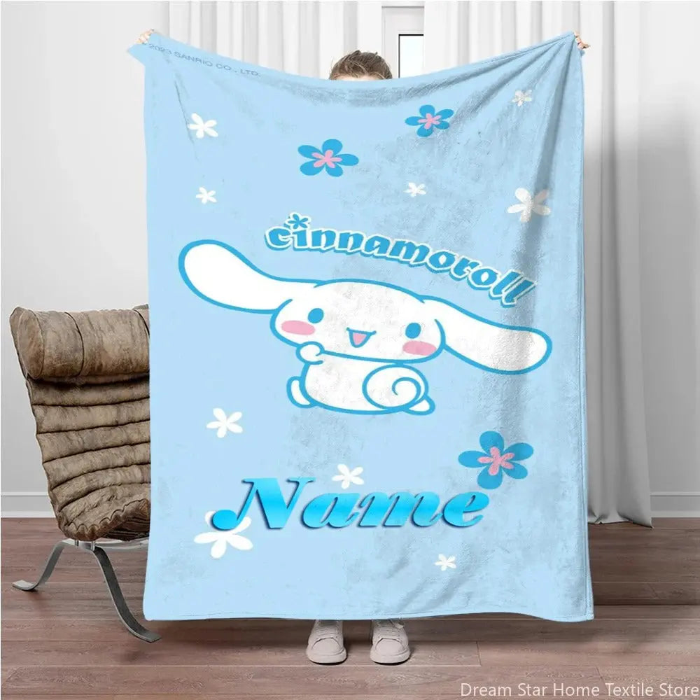 Cartoon bed blanket with Sanrio Cinnamoroll and customized name text, styled for cozy sleep time