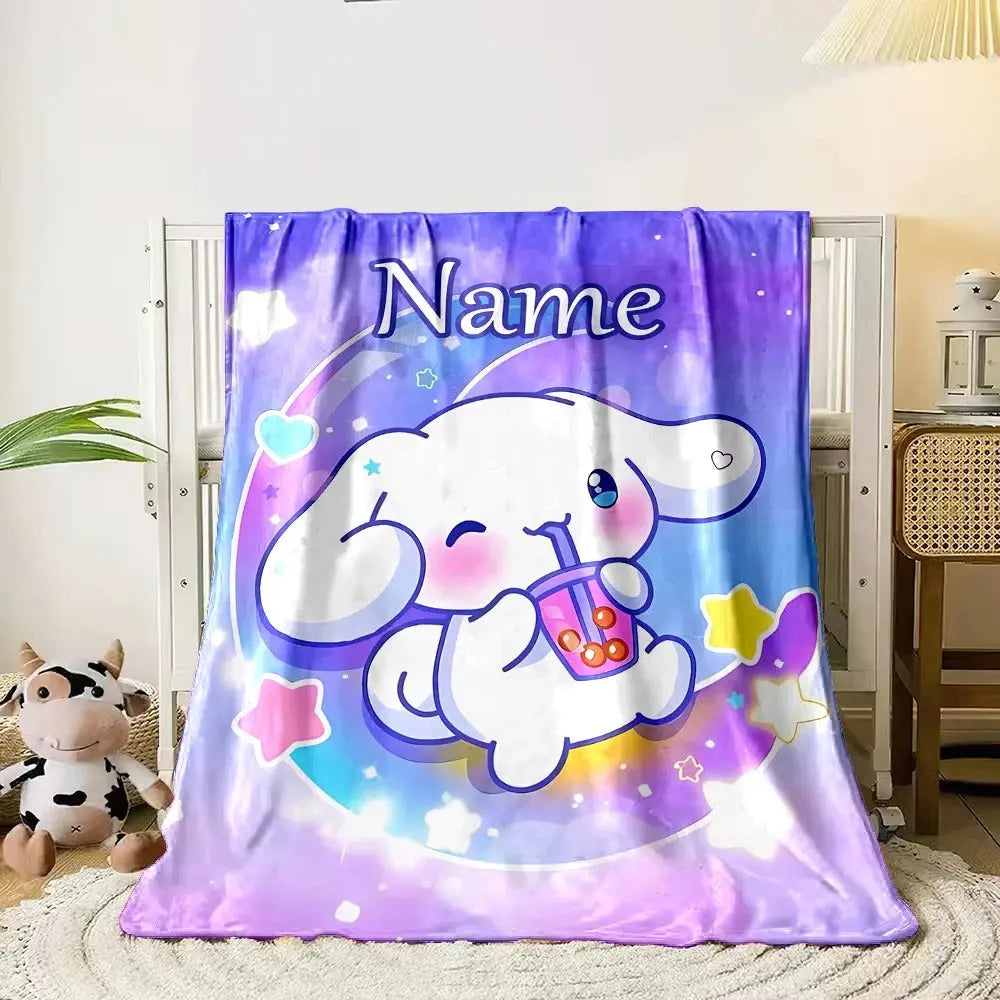 Cute Sanrio Cinnamoroll blanket with child’s name added, laid across a pastel-themed bed for girls