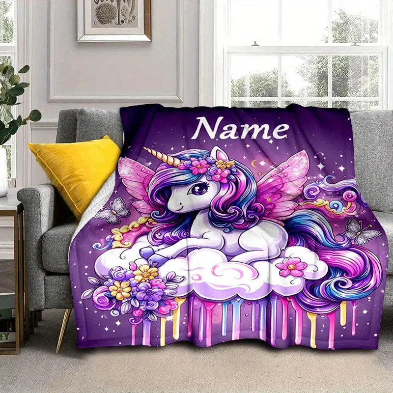 Close-up of soft flannel fabric on custom unicorn blanket showing vivid cartoon print and stitching