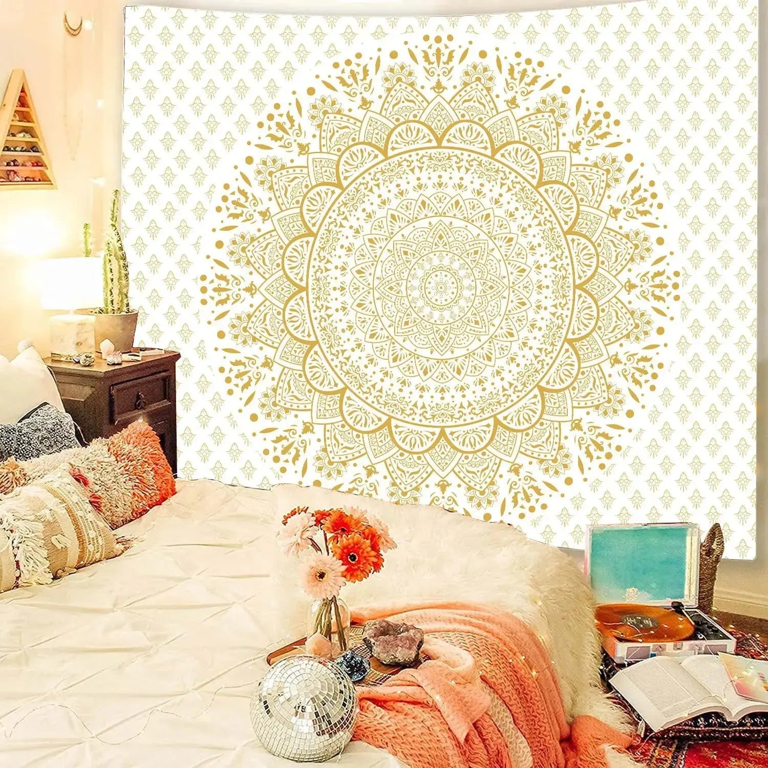 Indian Mandala bedspread hanging on a boho bedroom wall