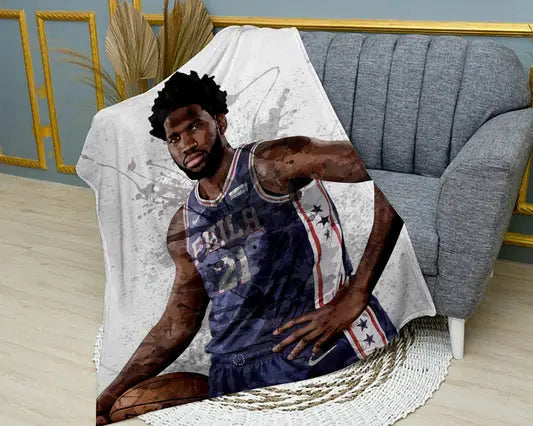 Joel Embiid splash effect flannel blanket featuring bold NBA graphics, ultra-soft and warm flannel fabric, and vibrant basketball-themed design perfect for fans’ bedding or couch throw