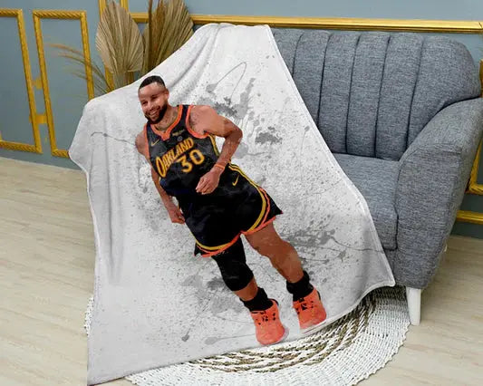 Stephen Curry splash effect flannel blanket in a bold graphic style featuring dynamic NBA artwork, ultra-soft warm fabric, and vibrant Golden State Warriors theme perfect for fans’ bedding or sofa throw