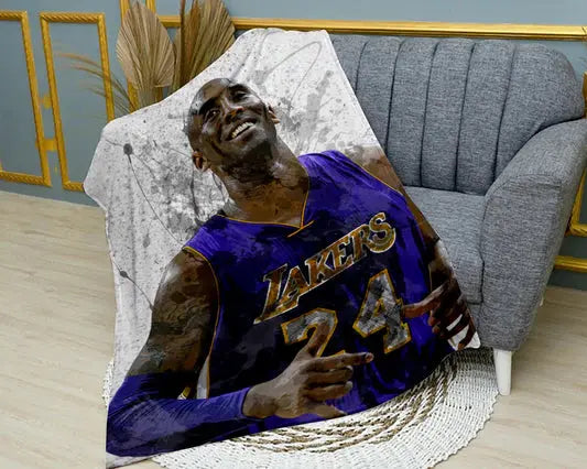 Kobe Bryant splash effect flannel blanket featuring bold NBA player artwork, ultra-soft warm fabric, and dynamic Lakers-themed design perfect for basketball fans’ bedding or sofa throw