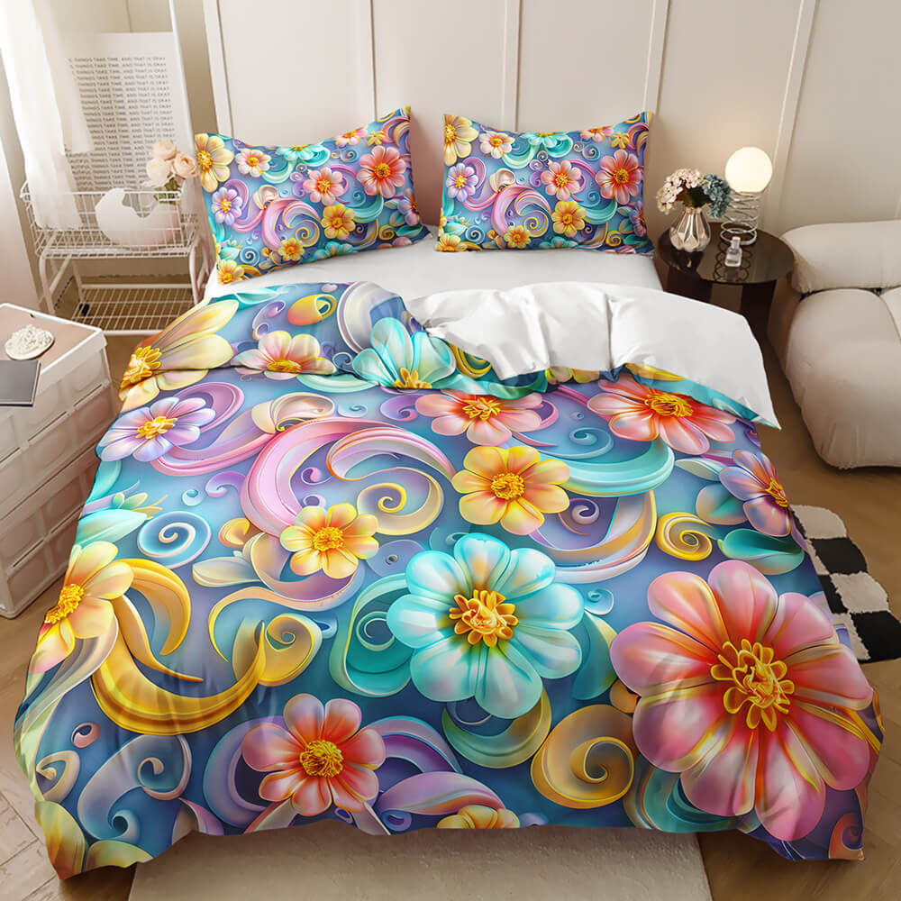 A colorful floral bedding set displayed on a bed in a styled bedroom. The duvet cover and two pillowcases feature a vibrant, swirling pattern of large flowers and swirls in shades of blue, pink, yellow, teal, and purple.