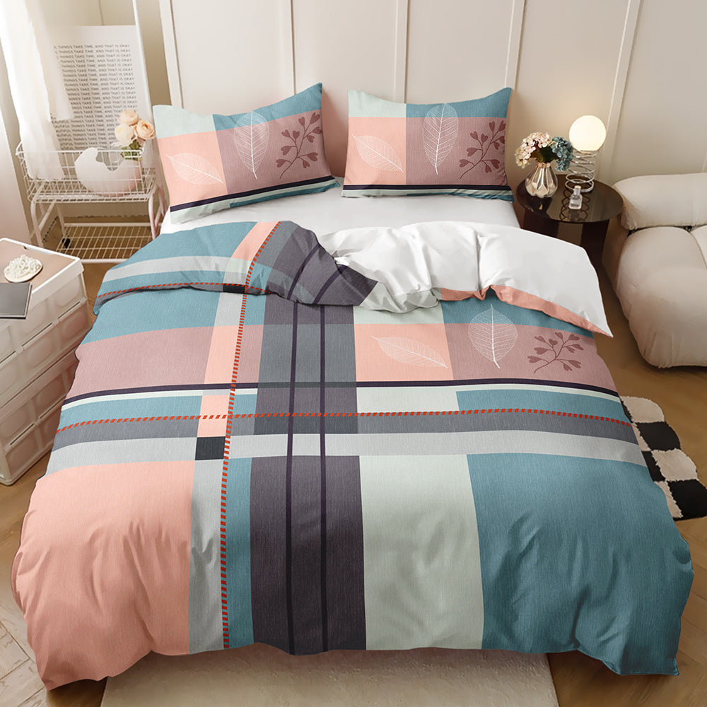 A bed dressed in a plaid bedding set with a geometric pattern in teal blue, dusty pink, gray, and white, styled in a modern bedroom setting.