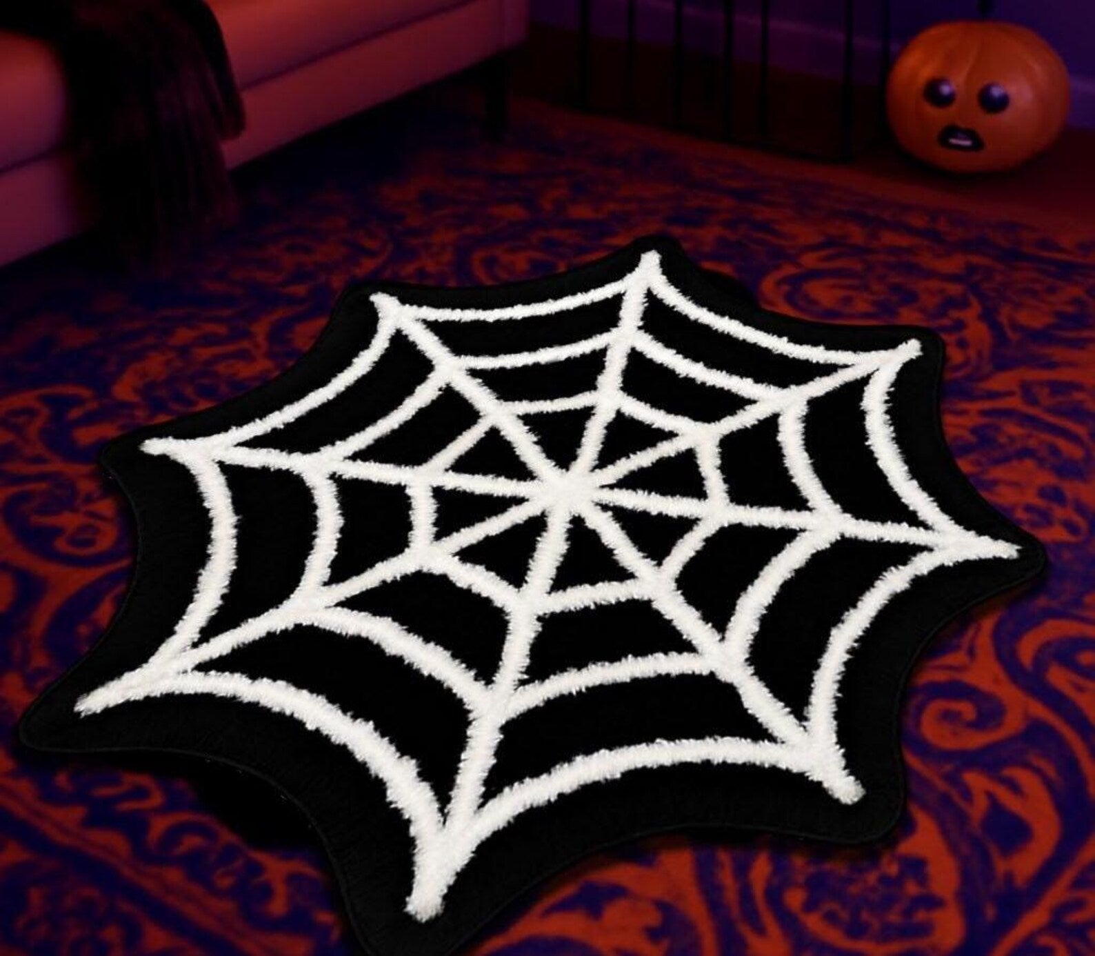 Halloween-themed floor rug with carved spider design
