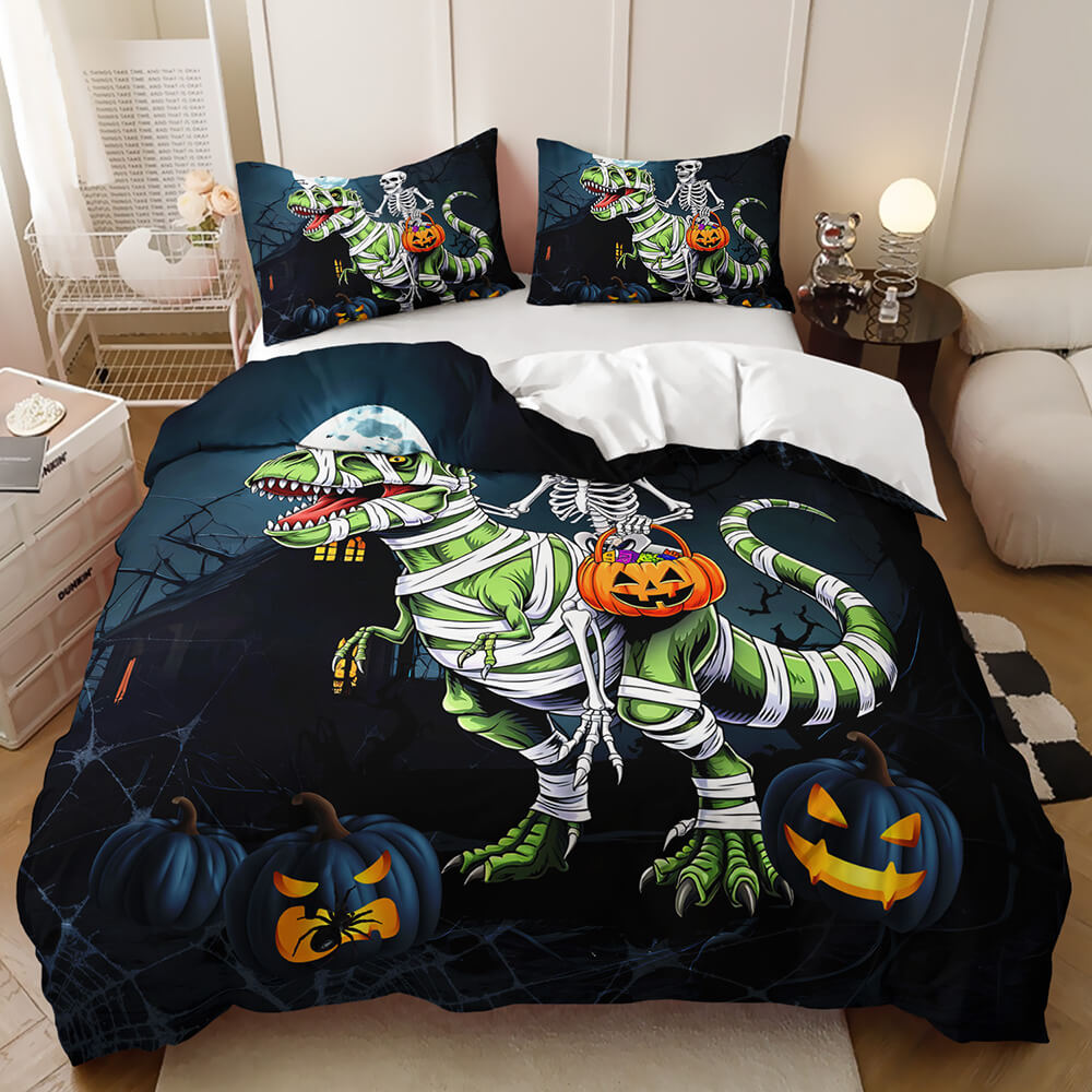 A Halloween-themed bedding set displayed on a bed in a bedroom setting. The set includes a duvet cover and two matching pillowcases featuring a green dinosaur skeleton mummified in bandages with glowing jack-o'-lanterns on a dark background.