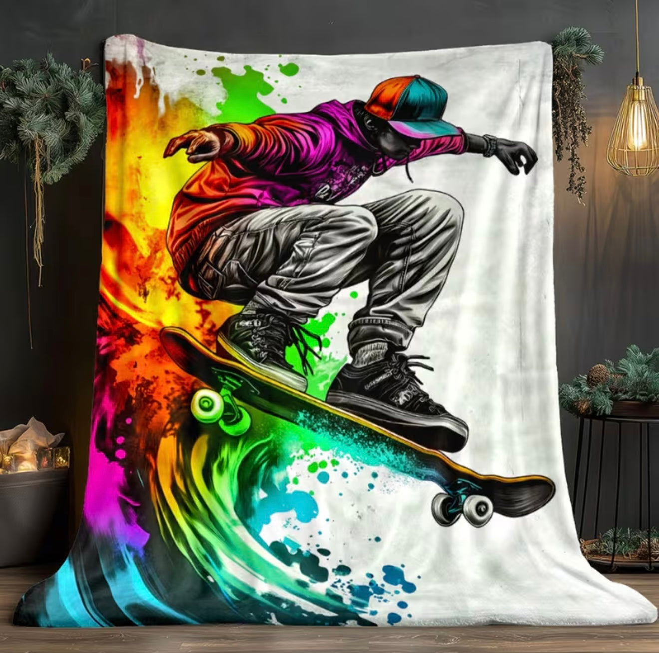 Colorful blanket with a graphic of a person on a skateboard against a multicolored abstract background.