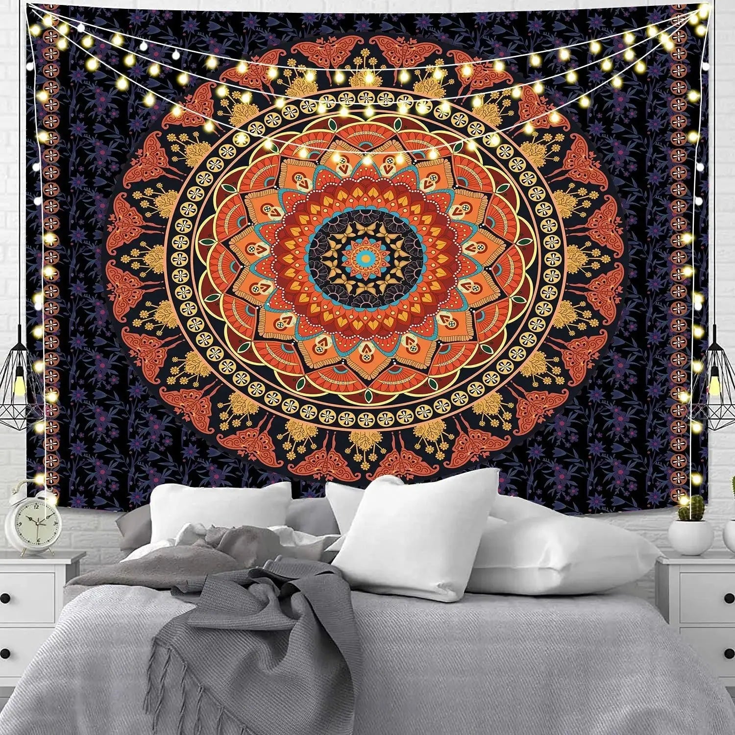 Indian mandala meditation sheet on wood floor with pillows and candles