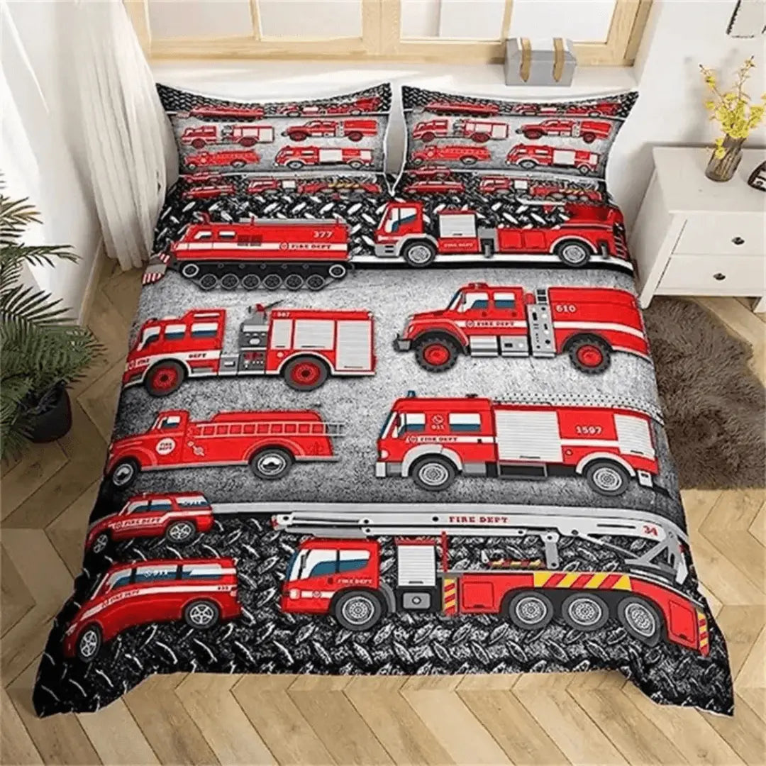Fire truck-themed bedding set on a bed in a bedroom.