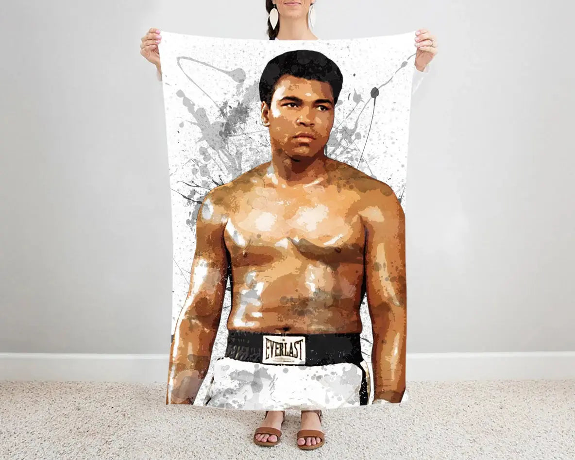 Muhammad Ali flannel blanket with splash effect design featuring iconic boxing legend graphics, ultra-soft warm fabric, and bold boxing-themed artwork perfect for fans’ bedding or sofa throw