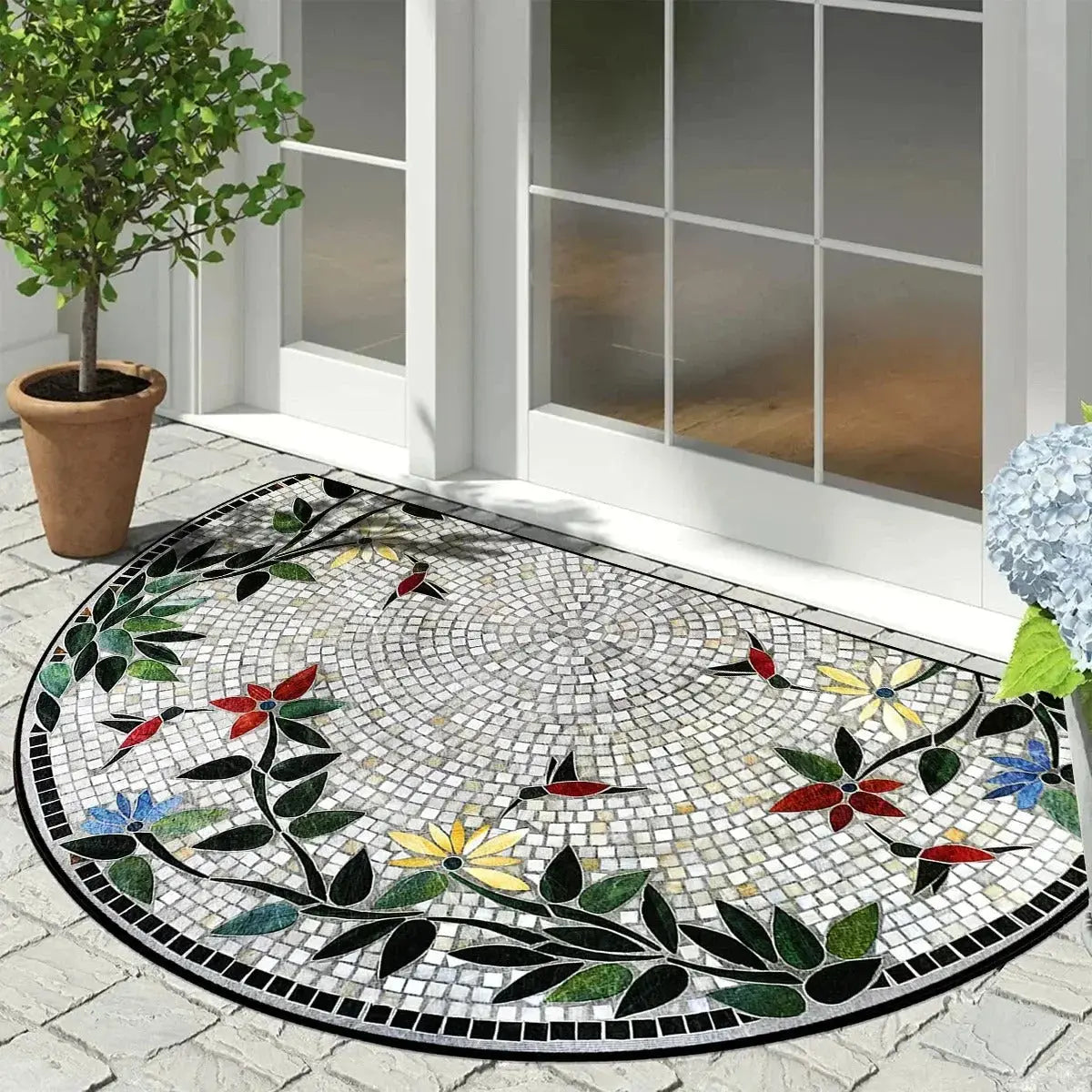 Half round semi-circle rug with mosaic bird and floral design placed near white glass door