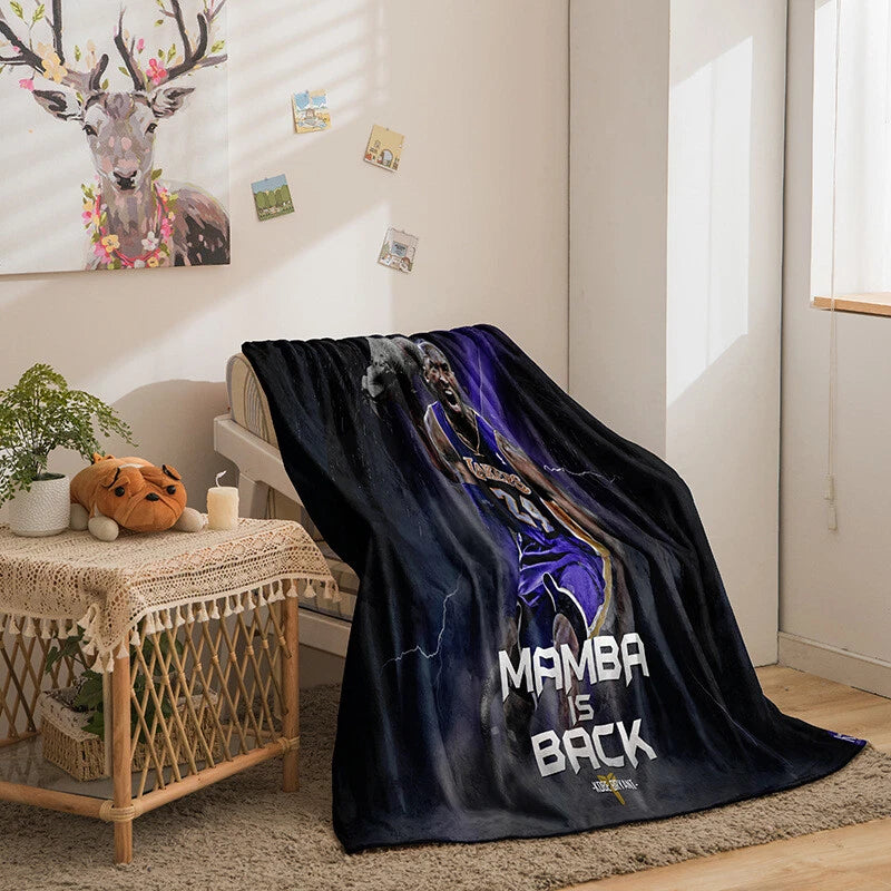 Lakers basketball blanket displayed on bedspread