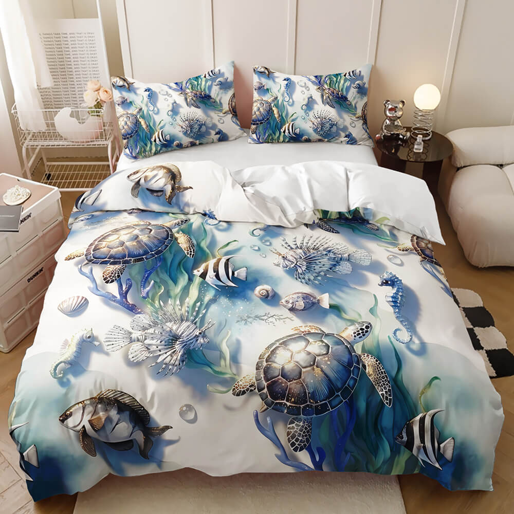 An ocean-themed bedding set featuring a duvet cover and two matching pillowcases with a detailed print of sea turtles, fish, and marine plants on a white background, styled in a bedroom setting.