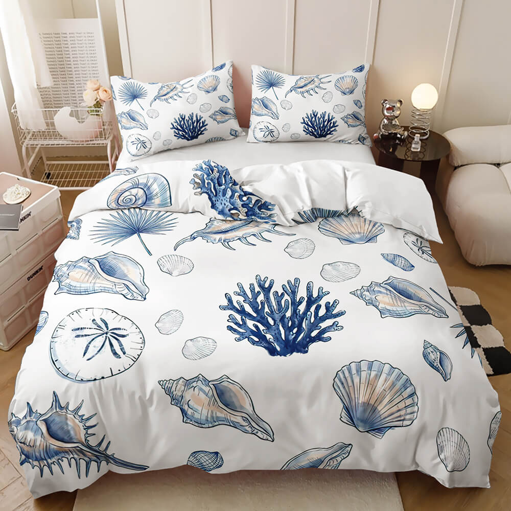 Colourful ocean animal bedding blue ocean-themed print featuring seashells, coral, and starfish, shown in a styled bedroom setting.