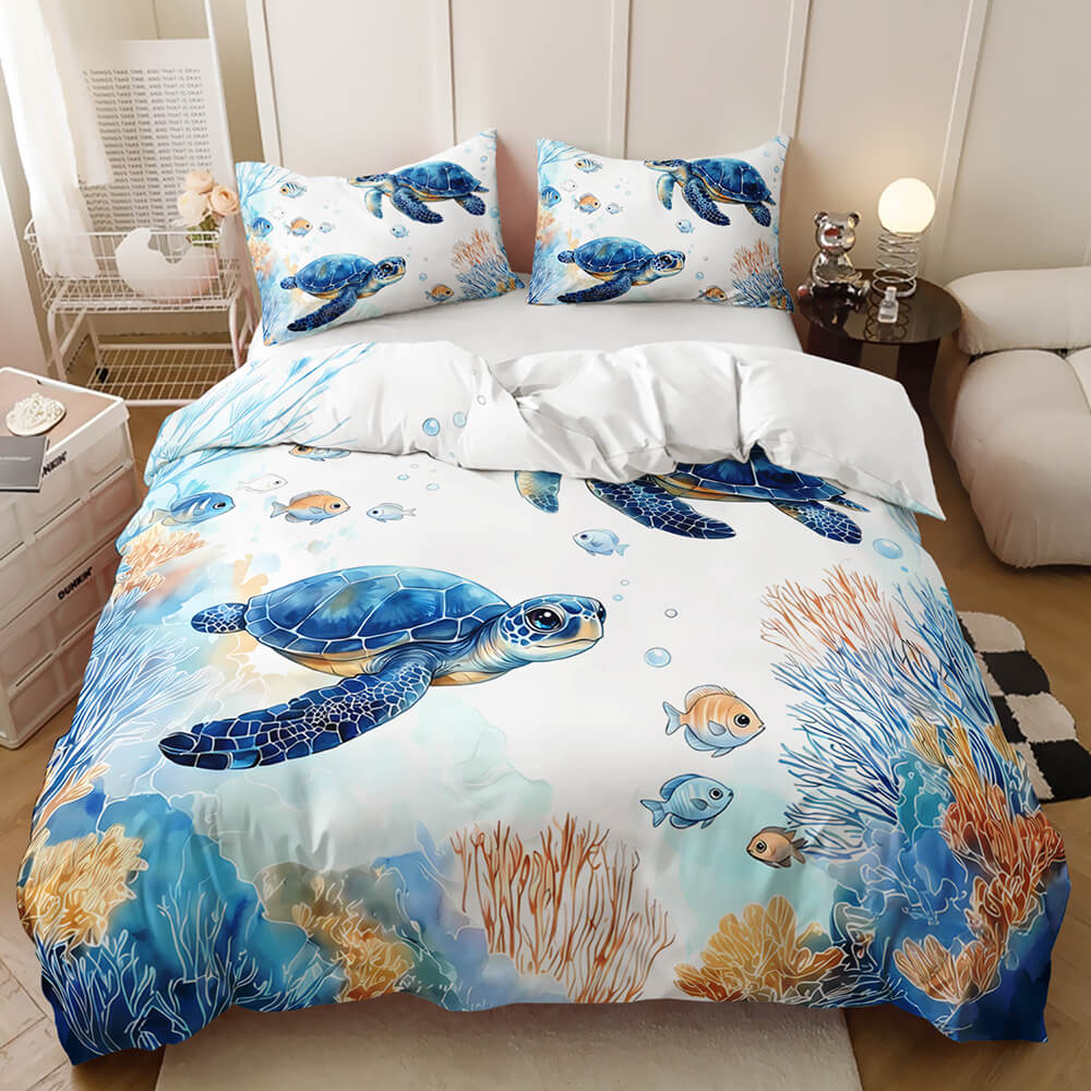 Marine life duvet cover blue sea turtle and coral reef print bedding set, shown in a styled bedroom with pillows, white bedding underneath