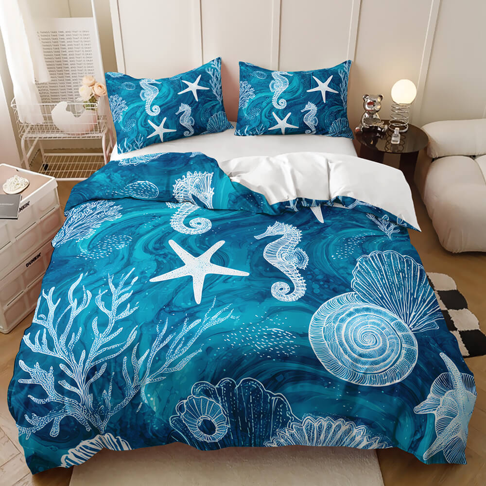 Ocean themed bedroom bedding blue and teal seahorse and starfish ocean-themed bedding set, shown in a styled bedroom with bedside tables, a lamp, and a sofa.
