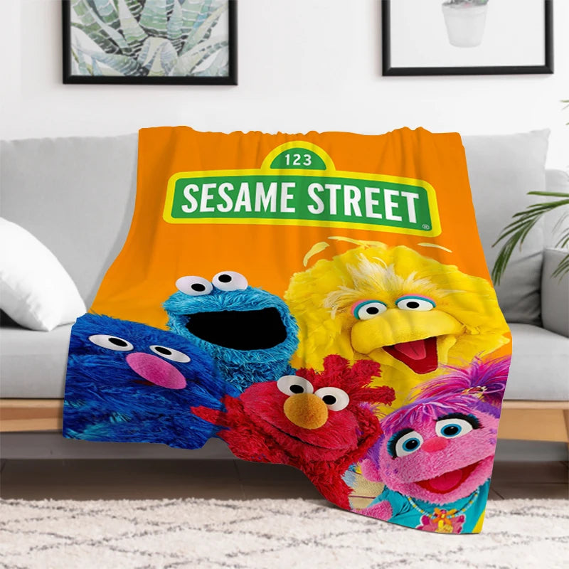 Packaging of Sesame Street Cookie Monster and Elmo kids blanket