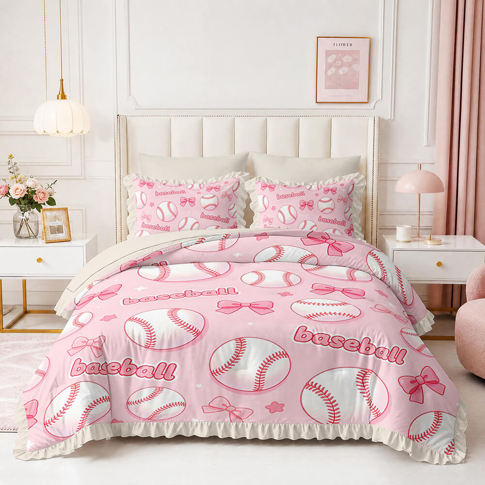 A pink and white baseball-themed bedding set with a duvet cover and matching pillowcases, styled on a bed in a bright, modern bedroom.
