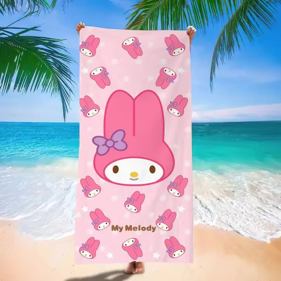 Pink cartoon towel with 'My Melody' character on a beach background