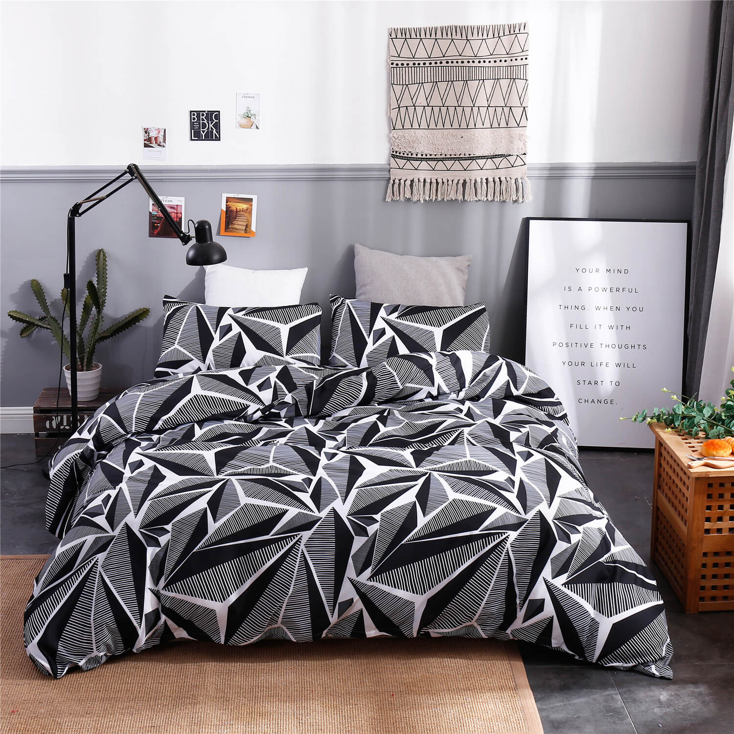 Geometric patterned bedding set in a bedroom with decor elements.