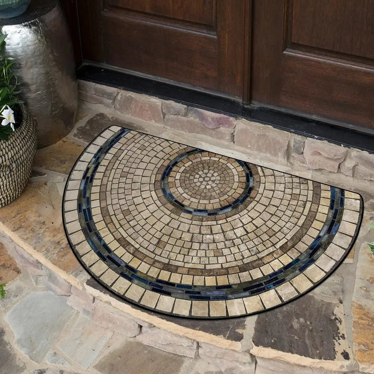 Rustic semi-circle rug with mosaic tile pattern at wooden door entrance