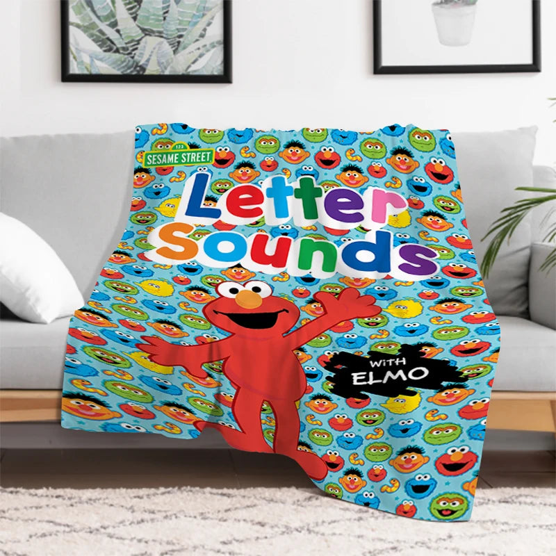 Sesame Street blanket folded showing vibrant Elmo and Cookie Monster colors
